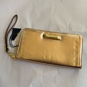 Steve Madden wristlet in Rose Gold.  Zip around wallet.